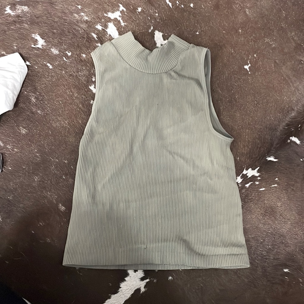 Sage green color sleeveless turtleneck top